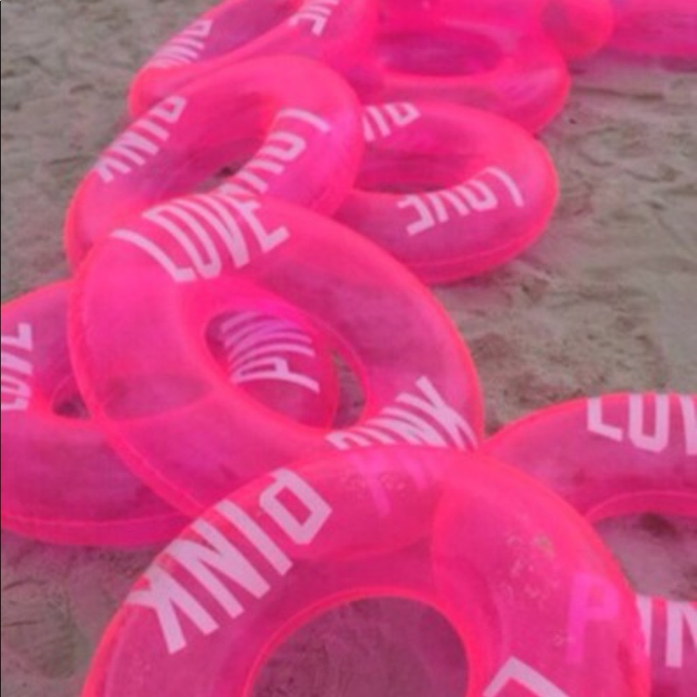 Pink vs pool floaty - Picture 2 of 3